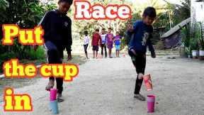 Race by jumping one leg with toes carrying a cup / Very fun outdoor game