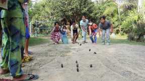Cambodian traditional game with forest tamarind seeds for Khmer New Year - Fun outdoor game